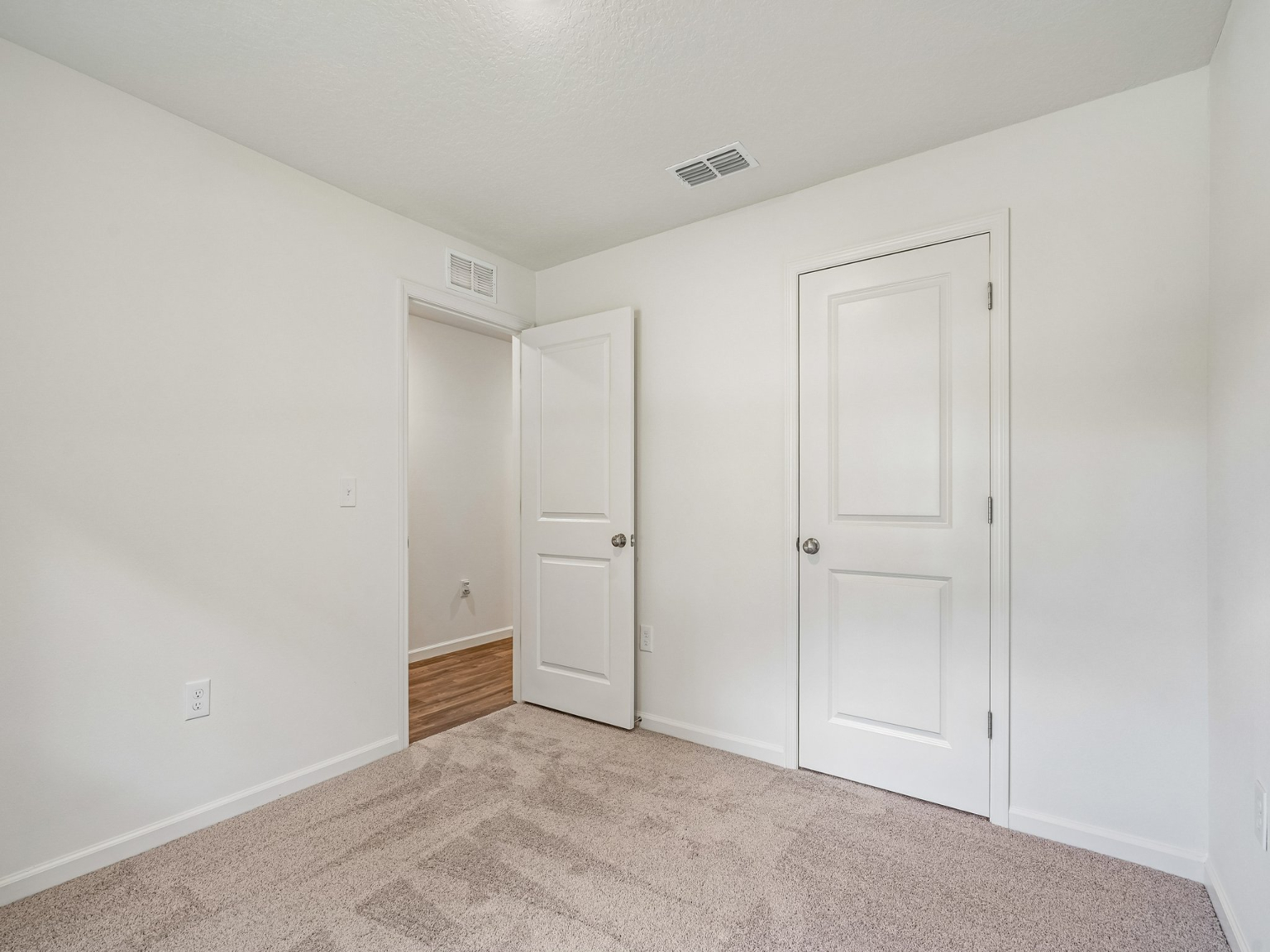A room with white doors.
