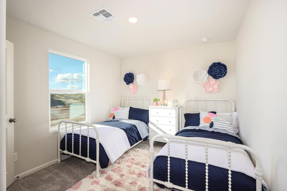 A bedroom with two beds.