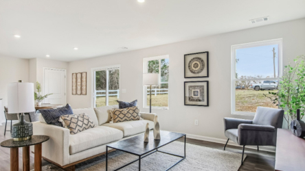 A living room with a large window.