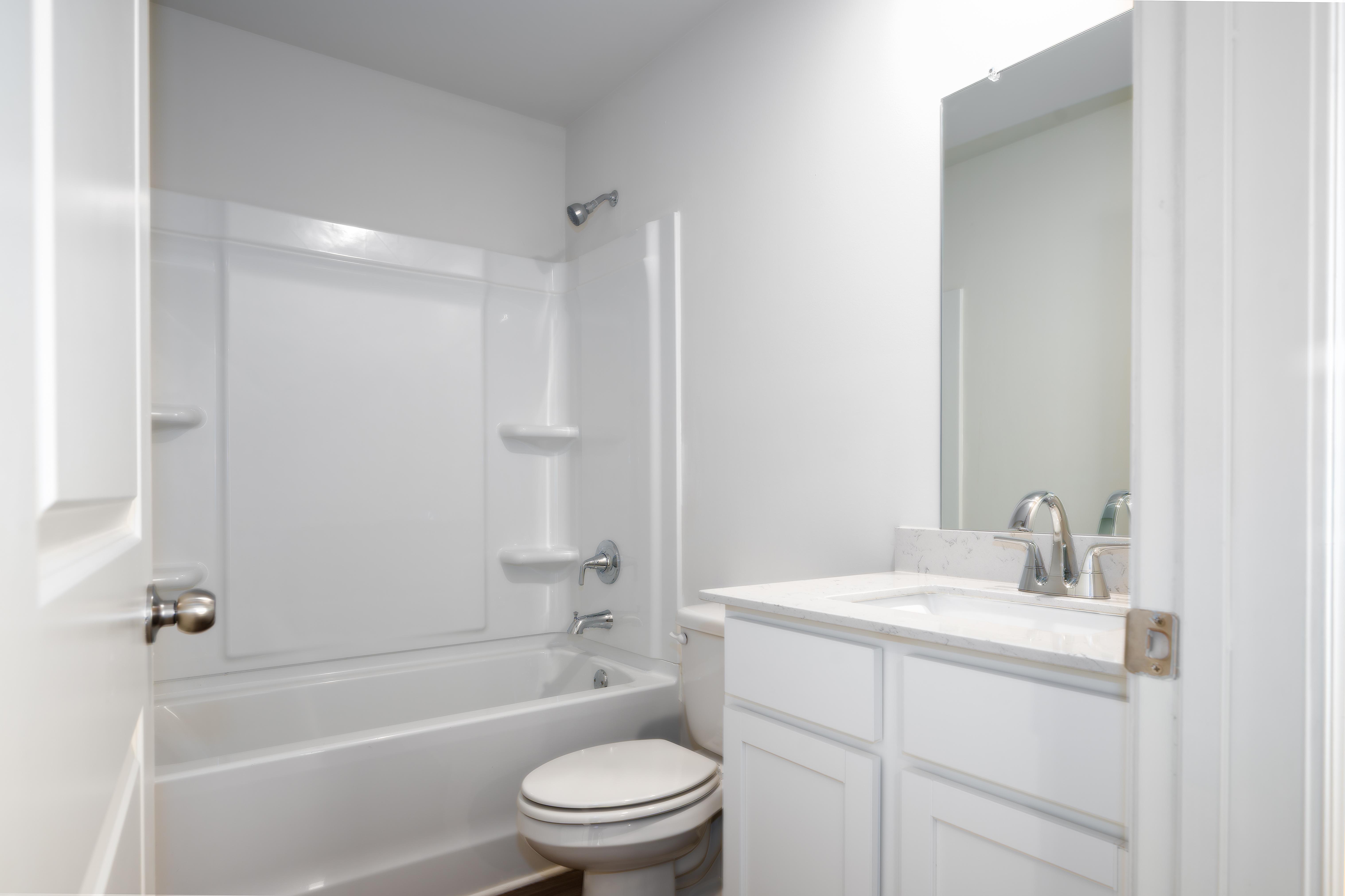 A bathroom with a toilet and sink.