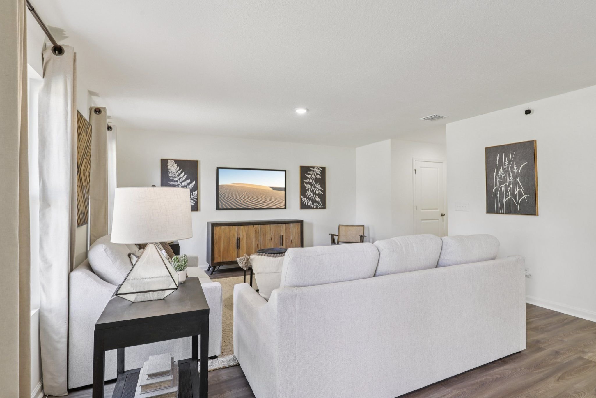 A living room with a white couch.