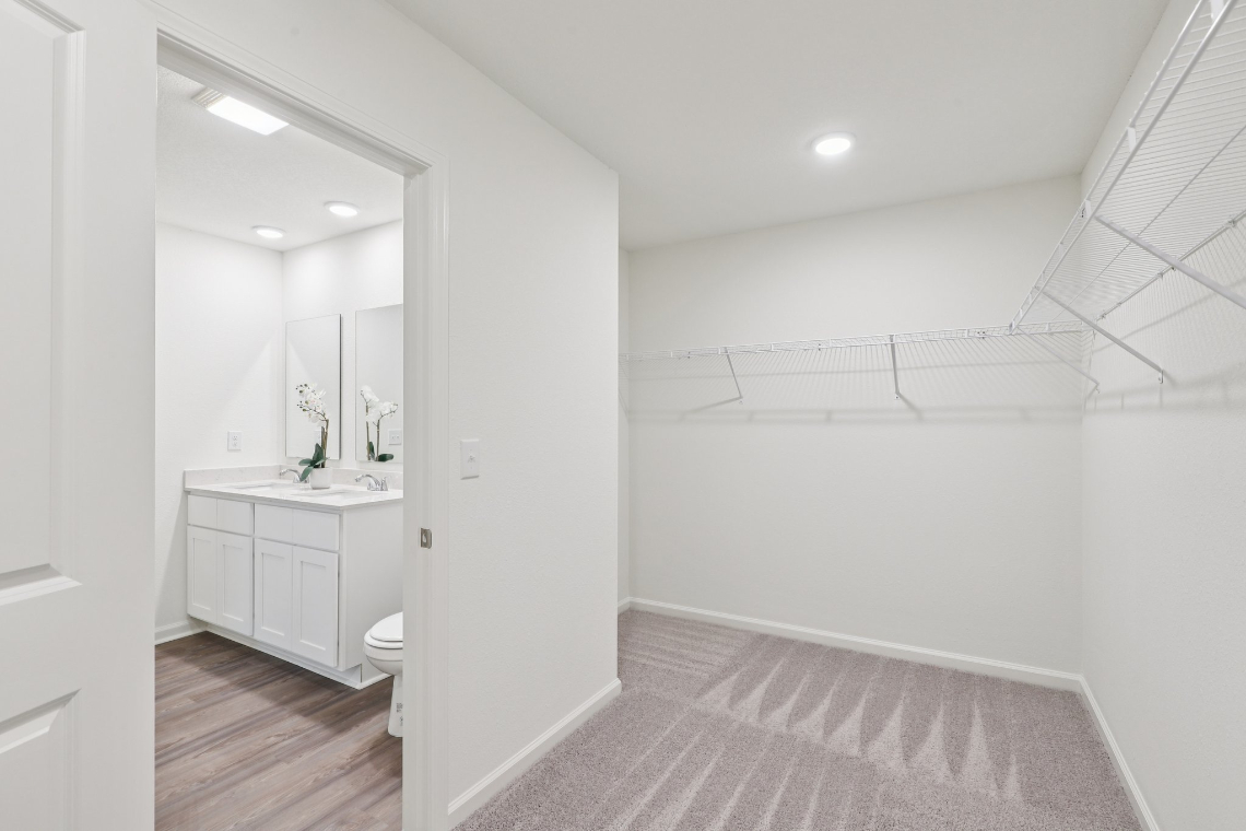 A bathroom with white walls.