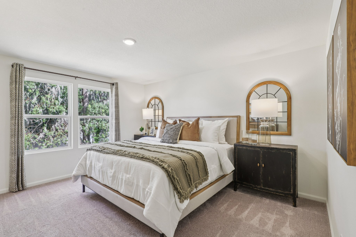 A bedroom with a large bed.