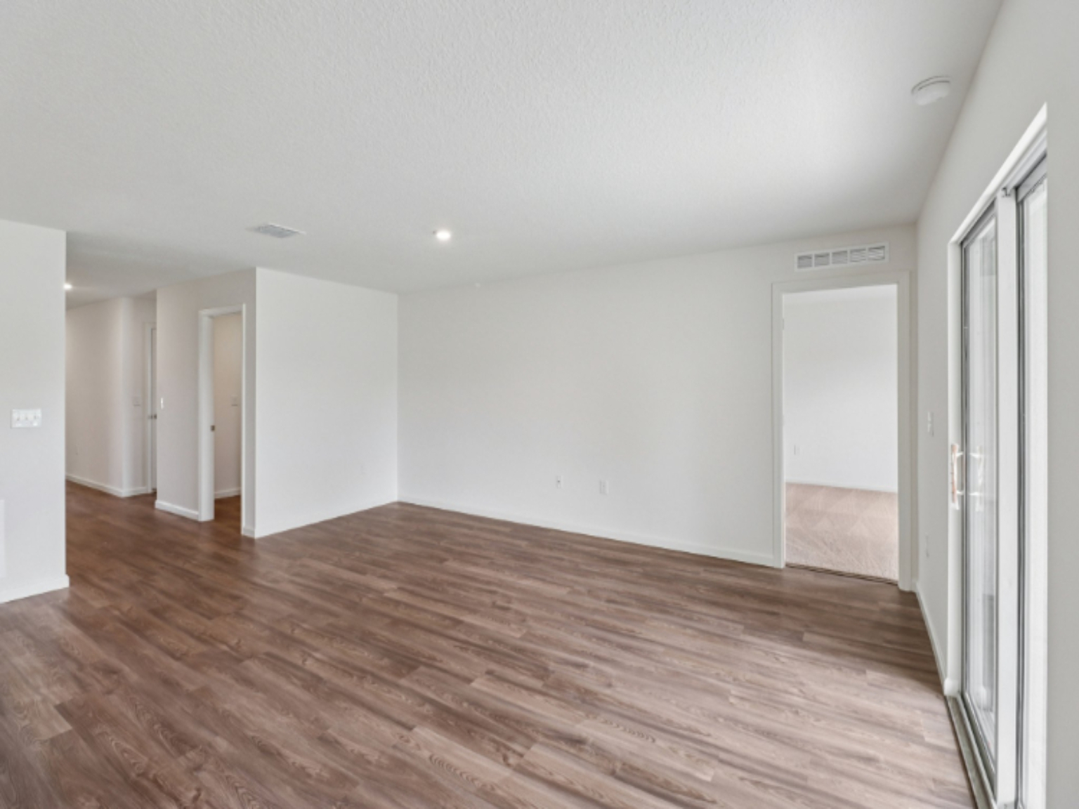 A room with wood floors.