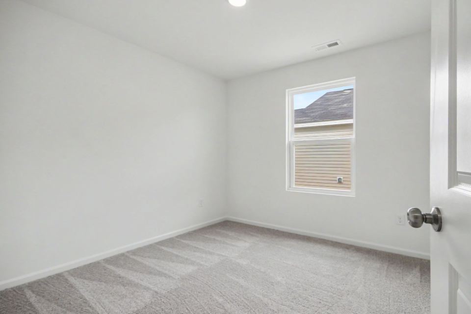 A room with a door and a window.