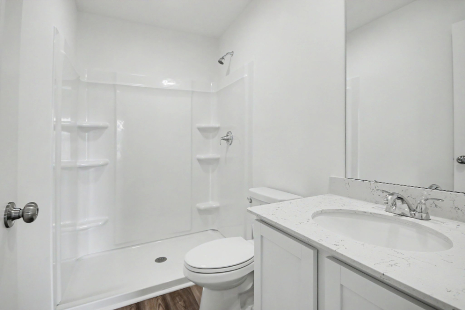A bathroom with a glass shower.