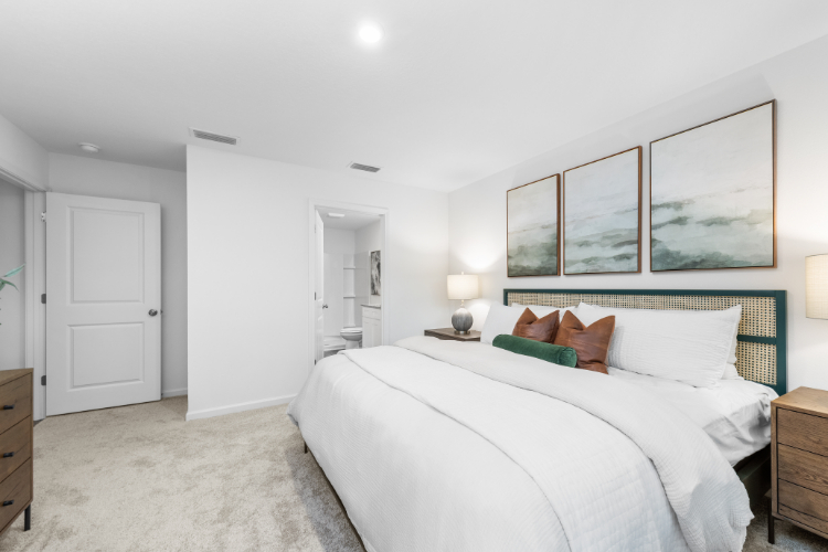 A bedroom with a bed and a couch.