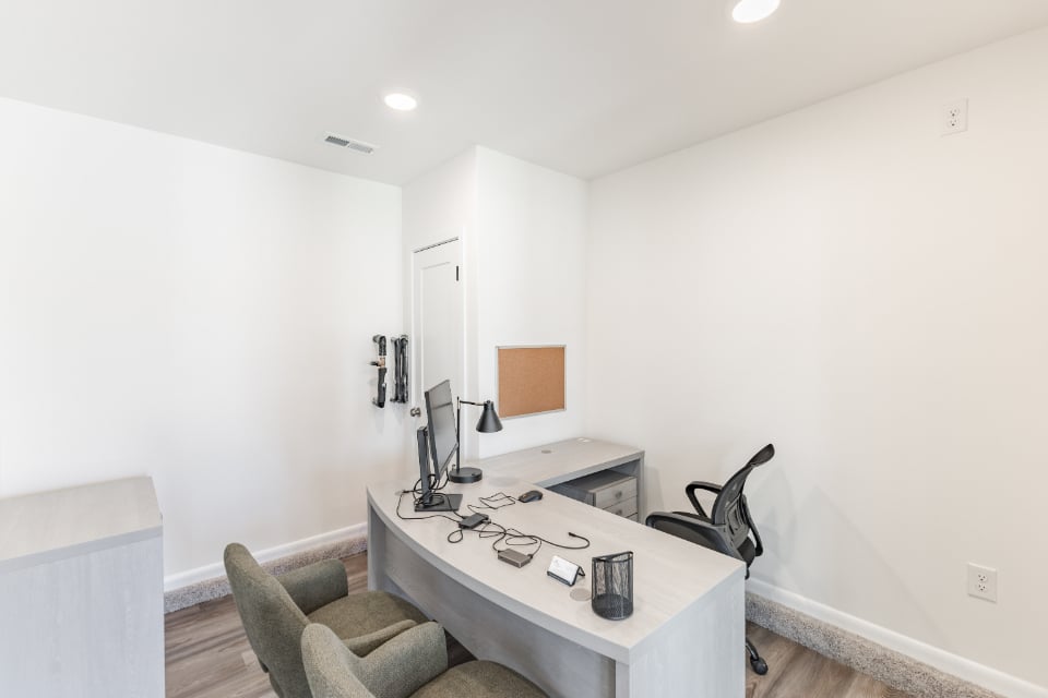 A room with a desk and chair.