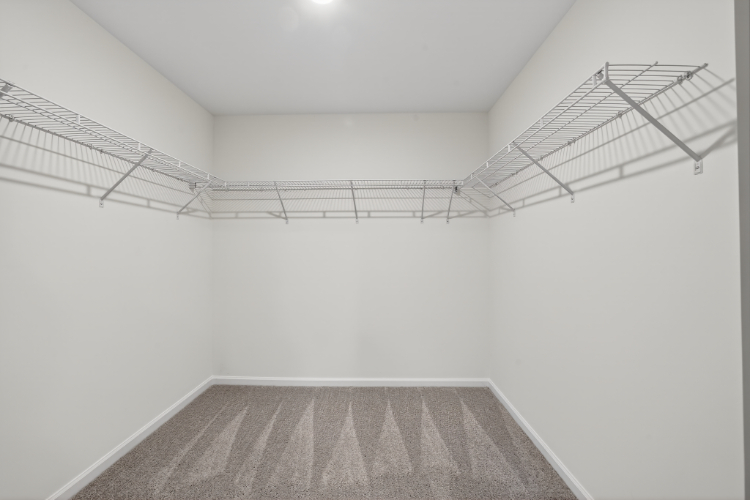 A white room with a staircase.