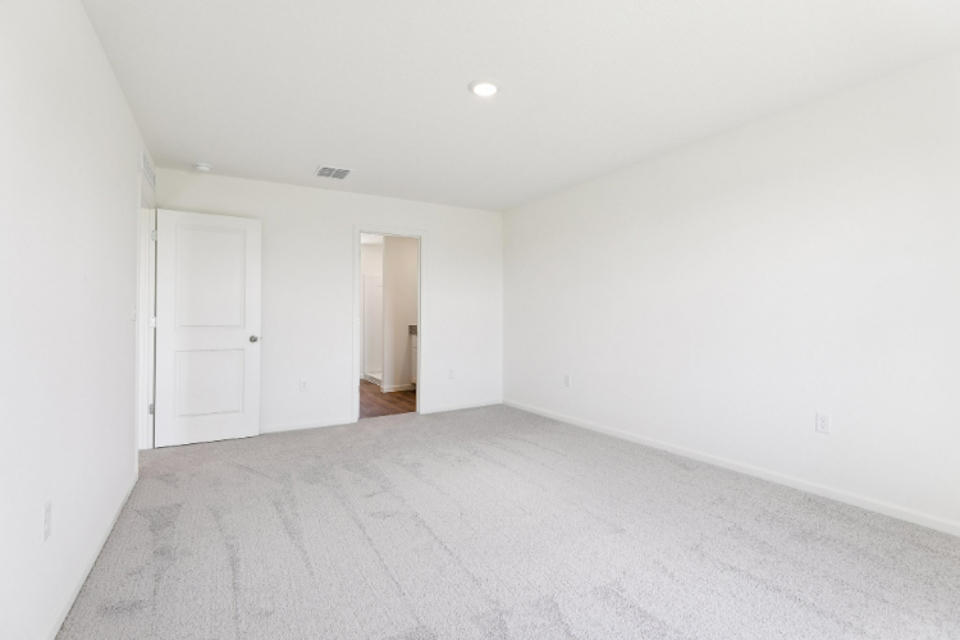 A hallway with white walls.