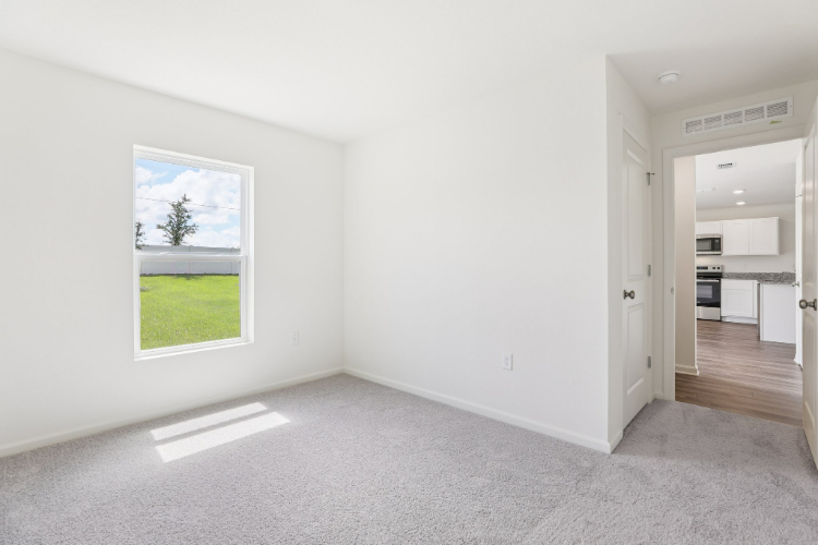 A room with a window and a door.