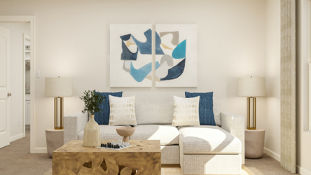 A living room with a couch and a coffee table.