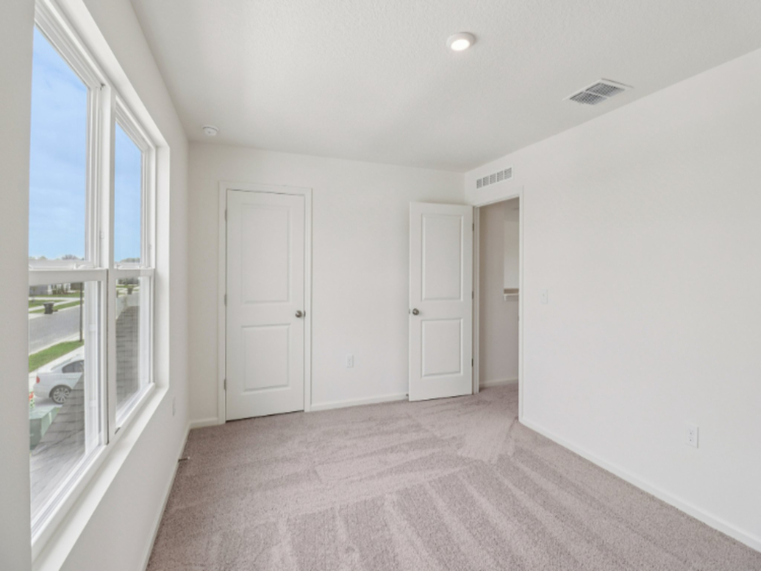 A room with white doors.