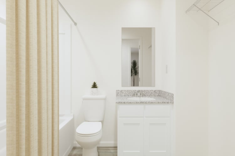 A bathroom with a sink toilet and a bathtub.