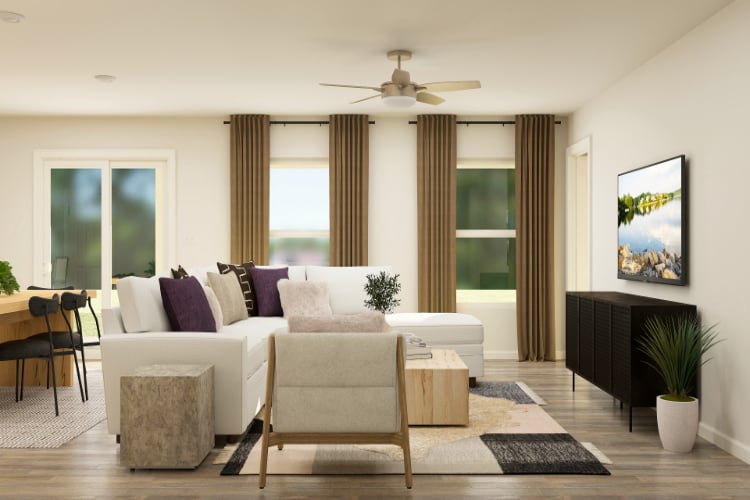 A living room with a fireplace and a large window.