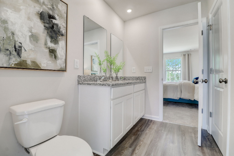 A bathroom with a marble countertop.