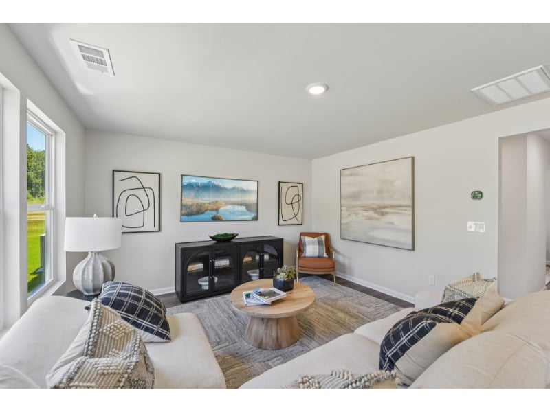 A living room with a couch and a coffee table.