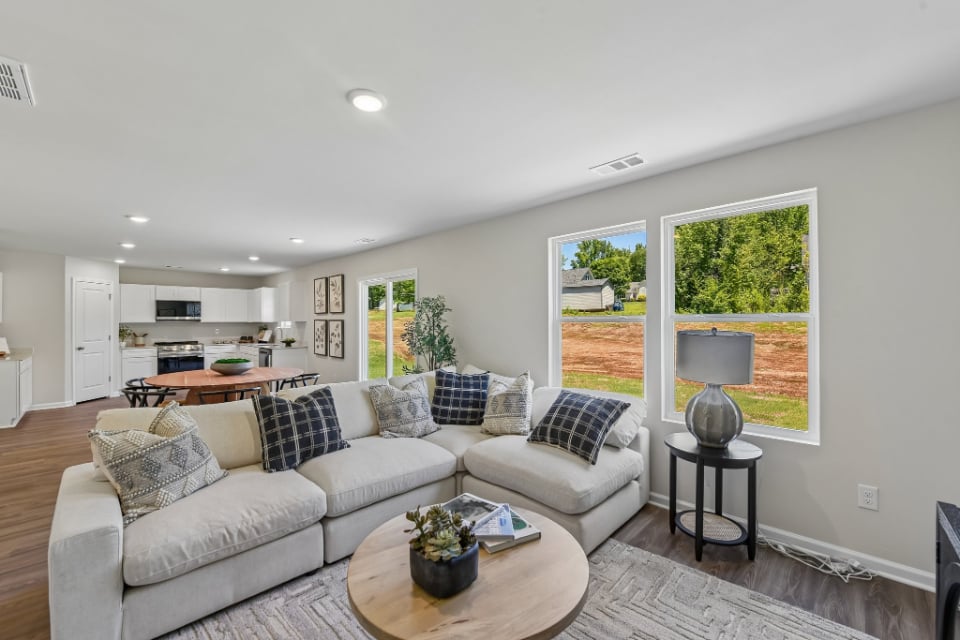A living room with a couch and a table.
