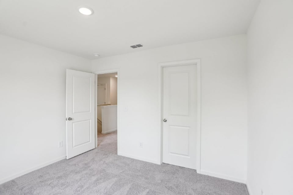 A room with white doors.