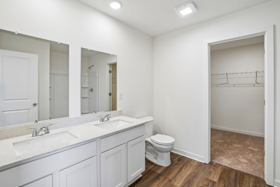 A bathroom with a toilet and sink.