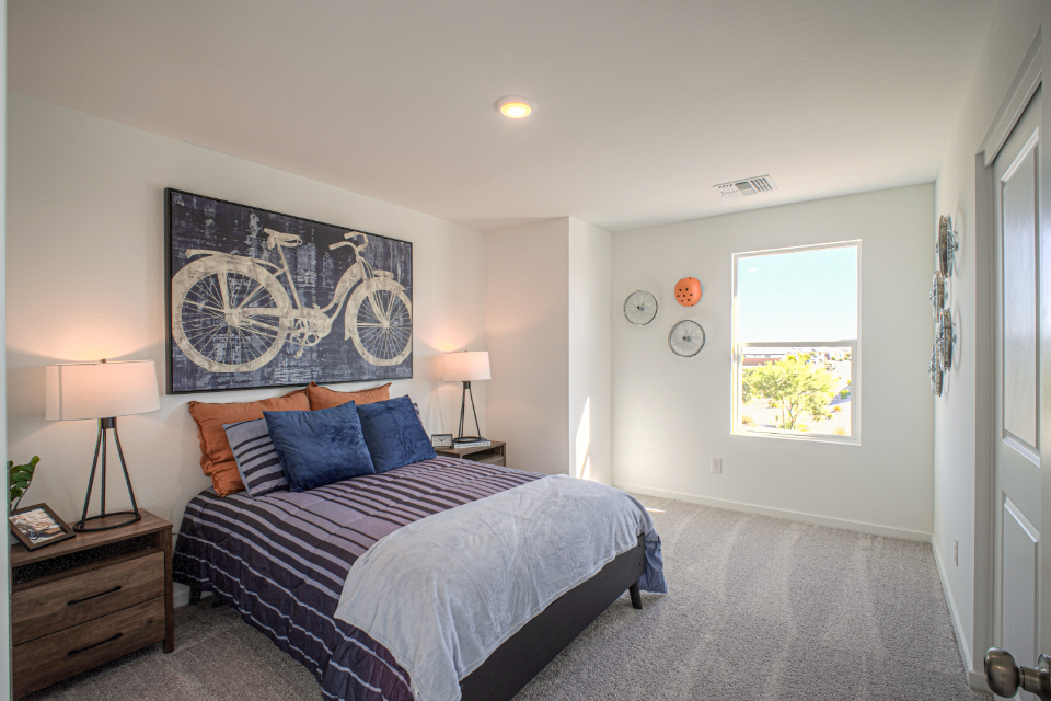 A bedroom with a large bed.