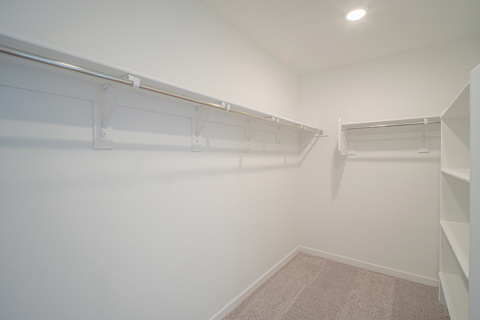 A white staircase in a room.