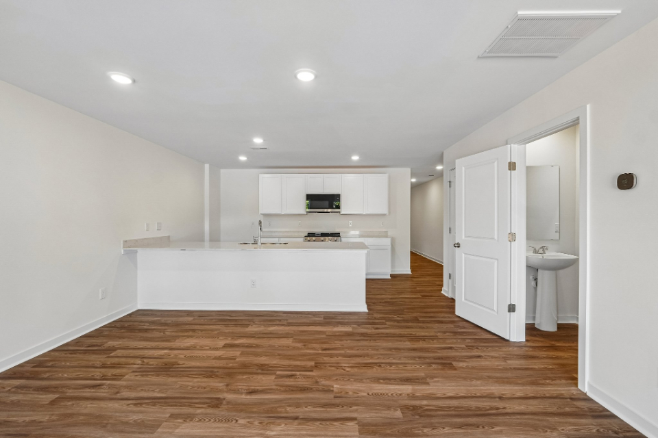 A large kitchen with white cabinets.