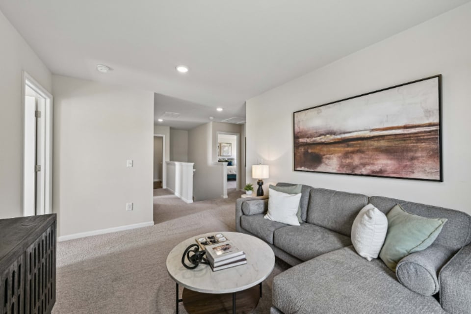 A living room with a couch and a coffee table.