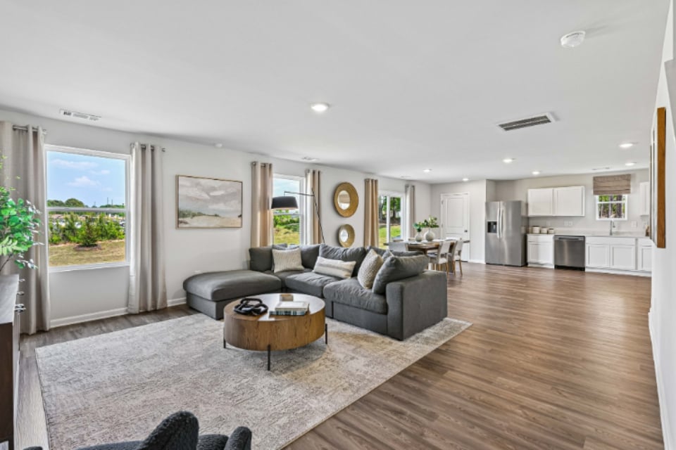 A living room with a large window.