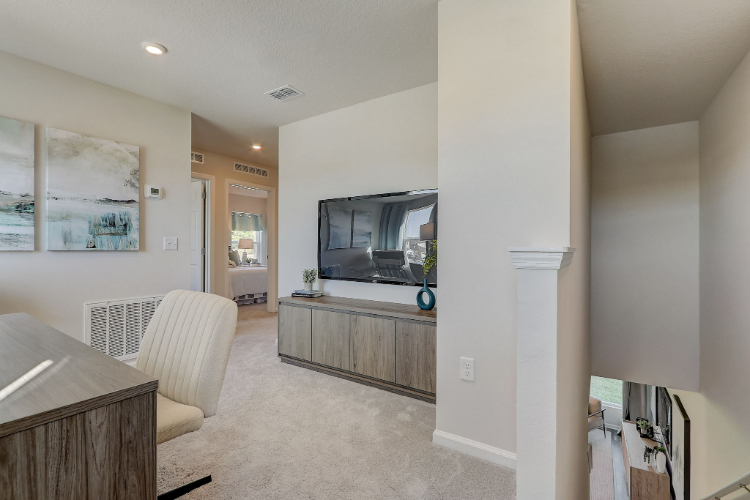 A living room with a tv and a couch.