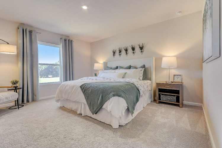 A bedroom with a large bed.