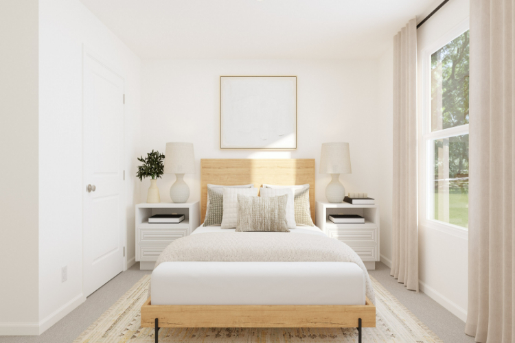 A white bed in a room.