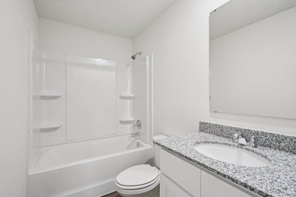 A bathroom with a sink and a bathtub.