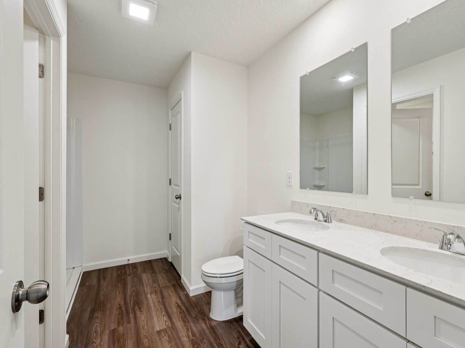 A bathroom with a toilet and sink.