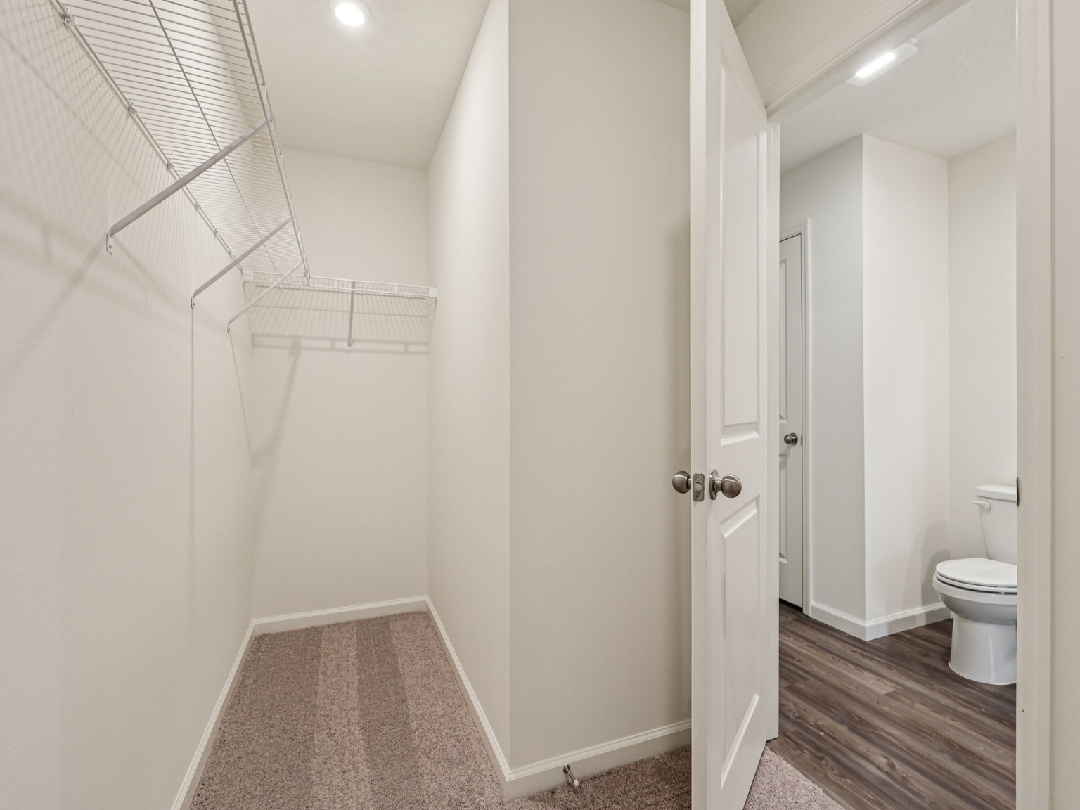 A bathroom with white walls.