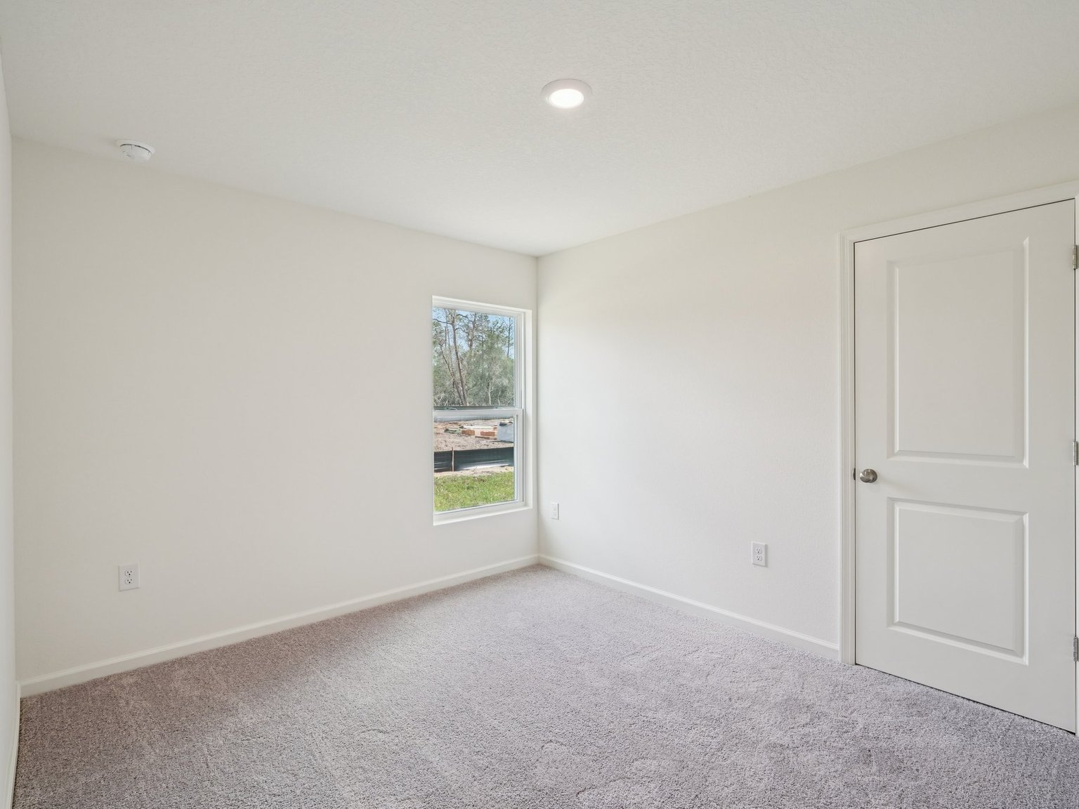 A room with a door and a window.