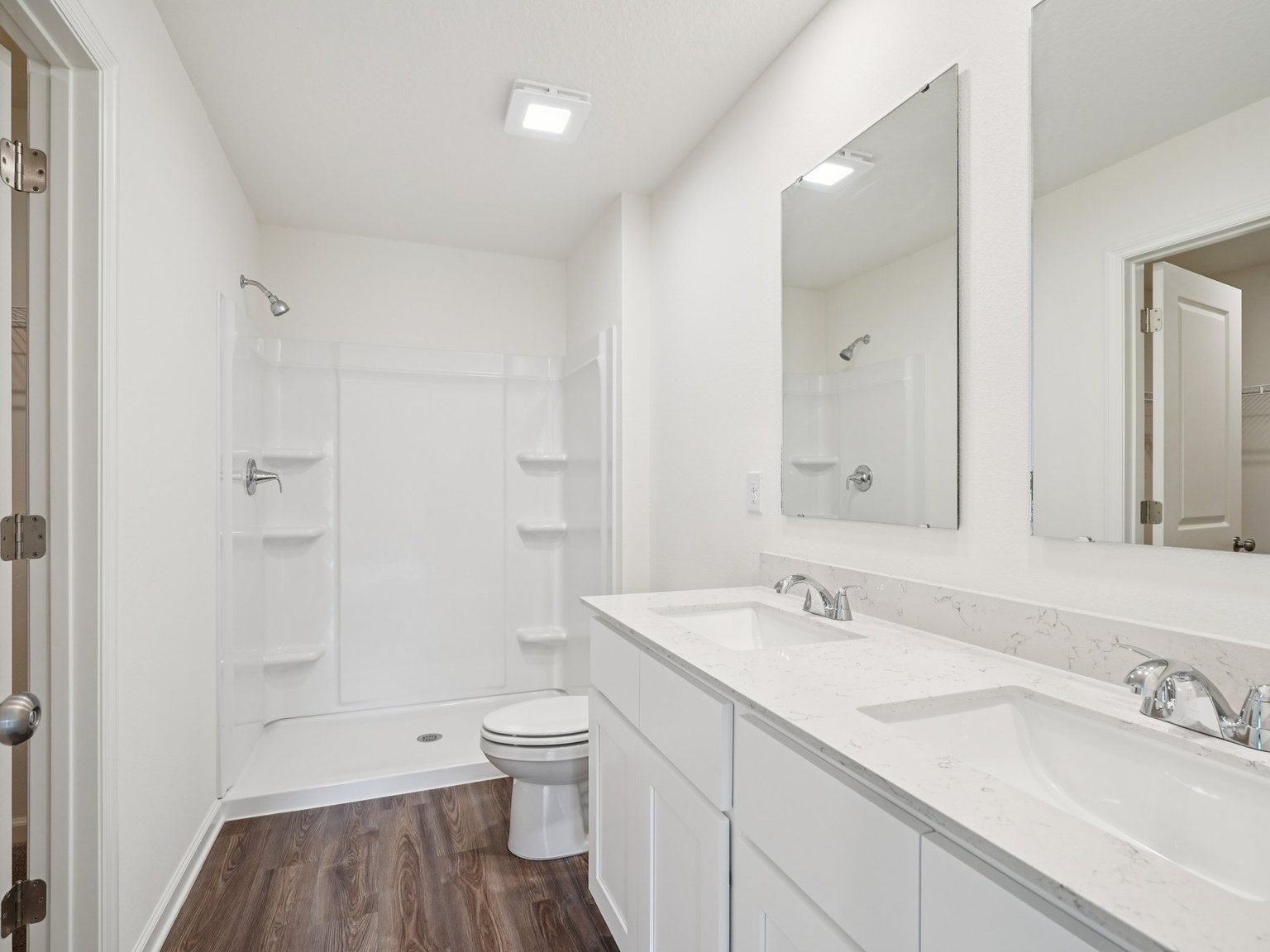 A bathroom with a tub sink and toilet.