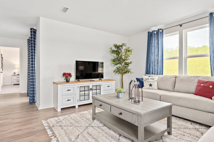 A living room with a tv and couches.