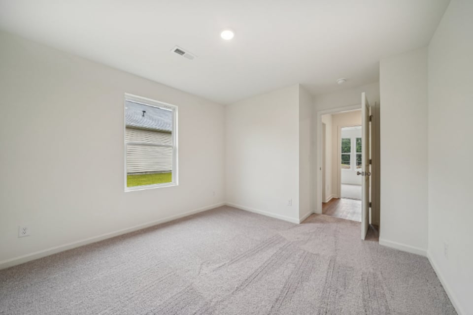 A hallway with white walls.