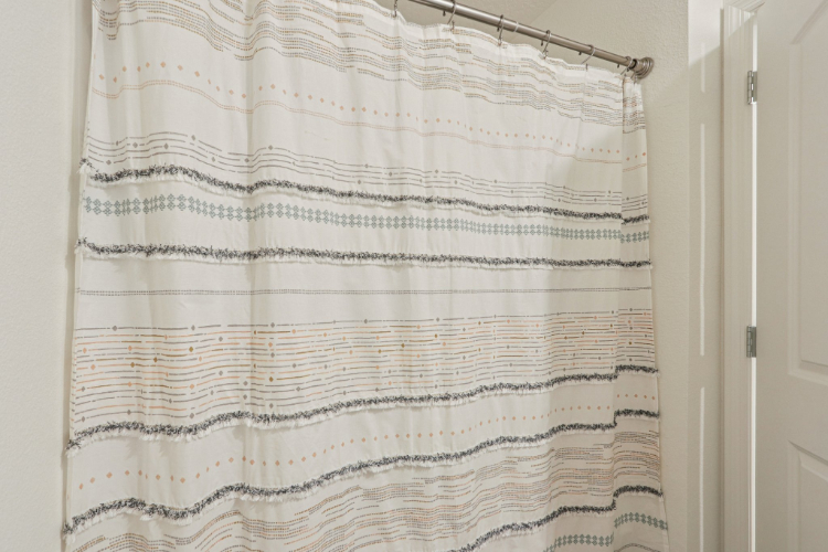 A white and black striped curtain.