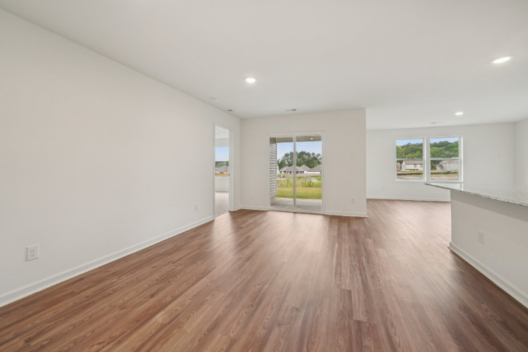 A room with a wood floor and a wood floor.