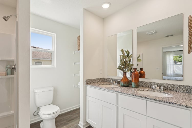 A bathroom with a marble countertop.