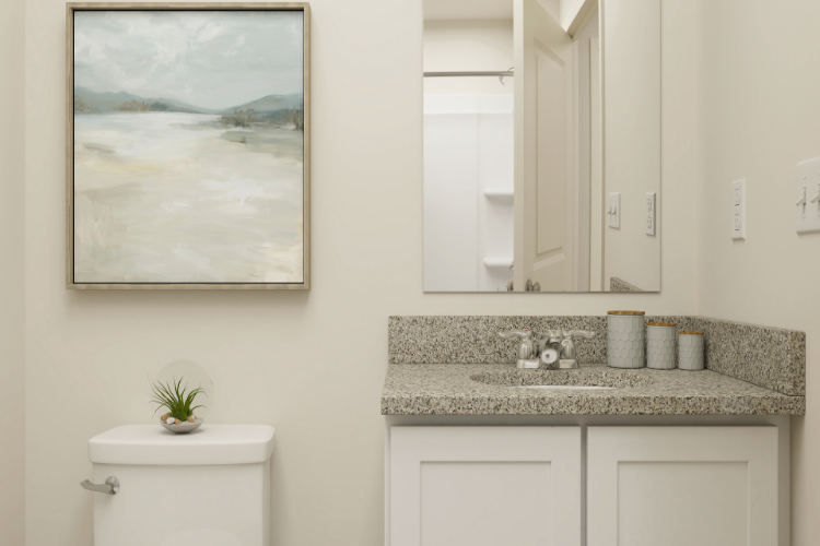 A bathroom with a large mirror.