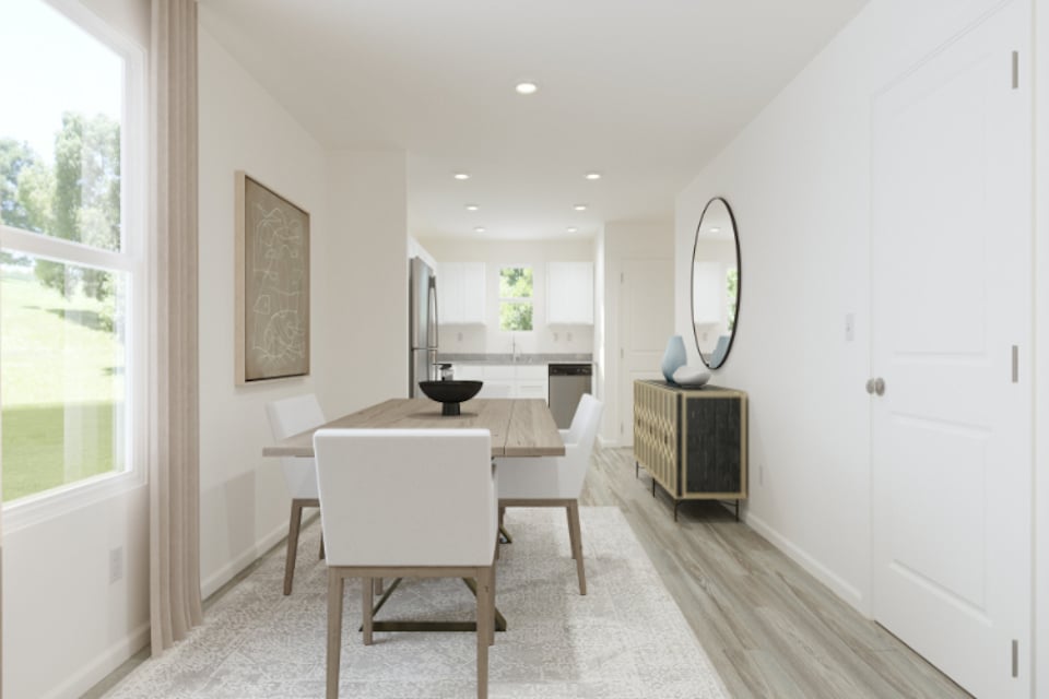 A room with a table and chairs.