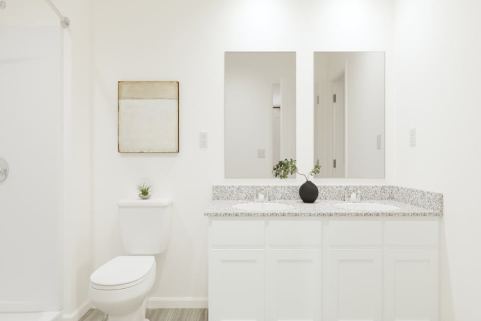 A bathroom with a toilet and sink.