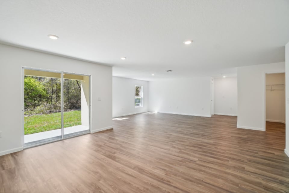 A room with a wood floor and a wood floor.