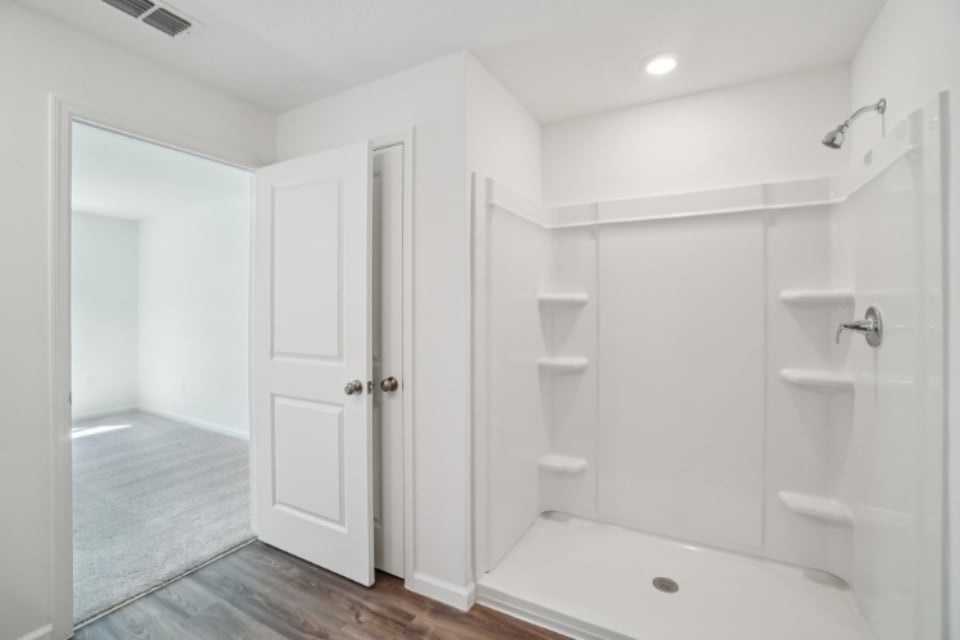 A bathroom with a tub and sink.