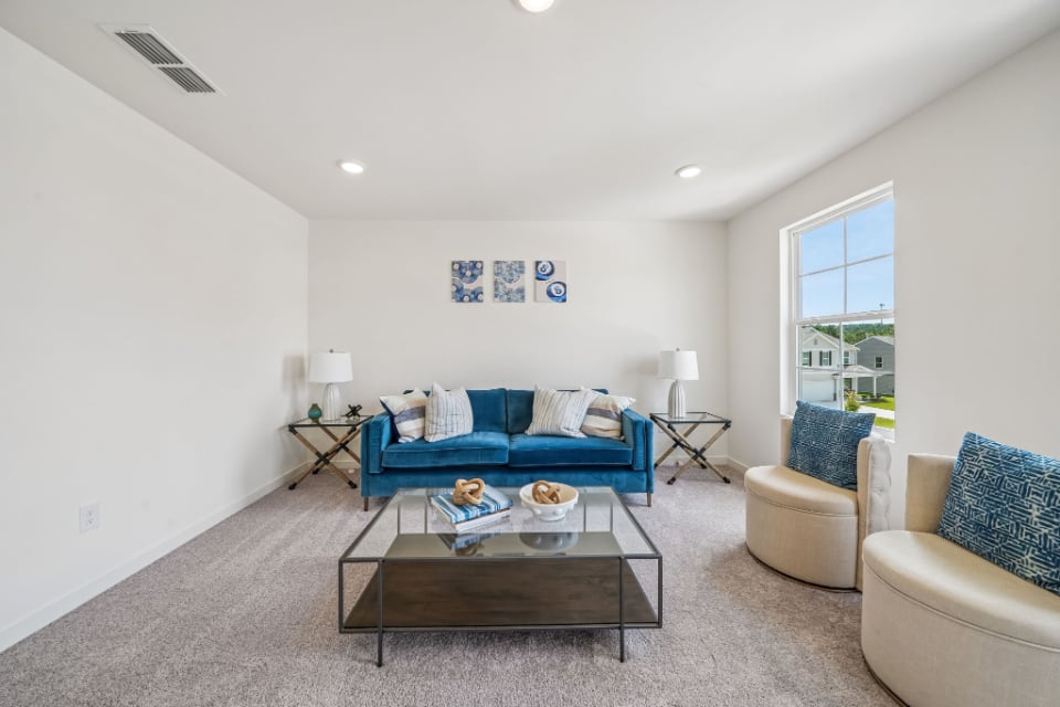 A living room with a couch and a coffee table.