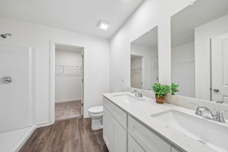 A bathroom with a tub sink and toilet.