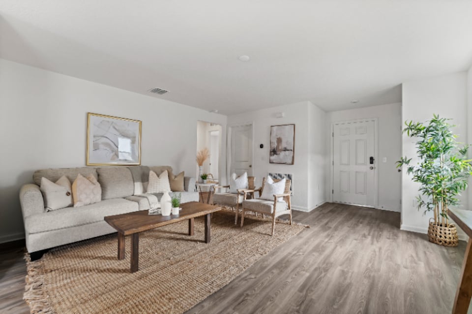 A living room with a couch and a coffee table.